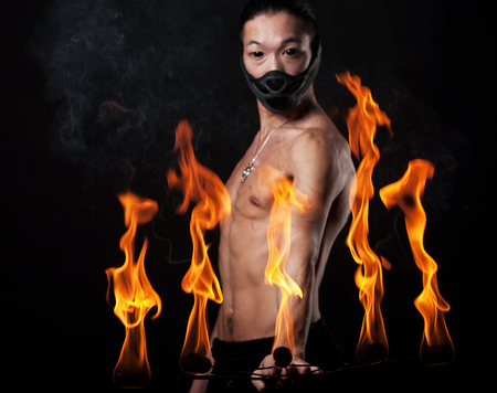 asian man with fire showの写真素材