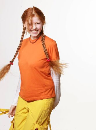 lovely redhead girl with long braidsの写真素材