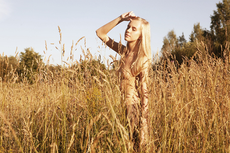 woman on field with clothes offの写真素材