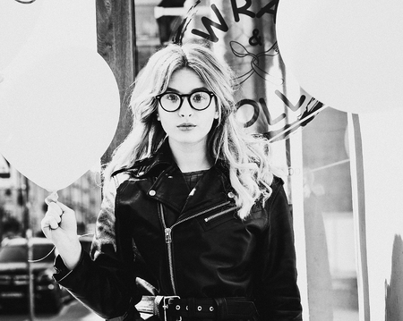 lifestyle, fashion and people concept: girl in the city, black a