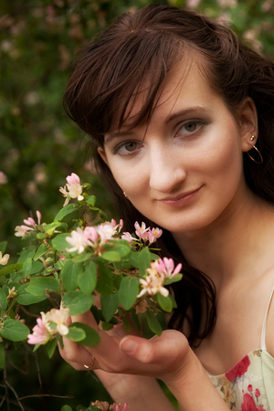 young woman in the summer gardenの写真素材