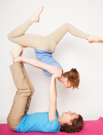 lifestyle, sport  and people concept: Young couple in yoga poseの写真素材