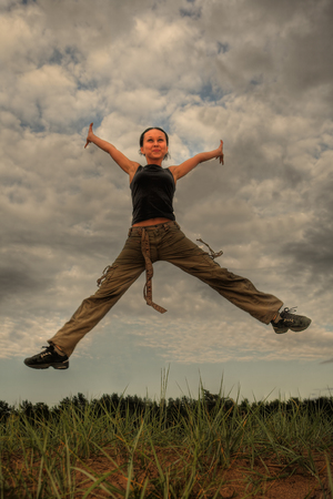 Jumping girl, summer dayの写真素材