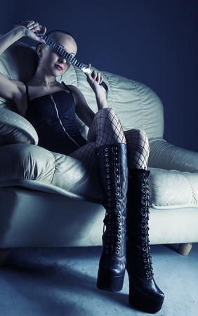 Portrait of sexy young model on sofaの写真素材