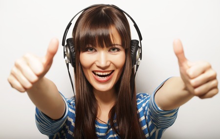 lifestyle and people concept: young woman with headphones listenの写真素材