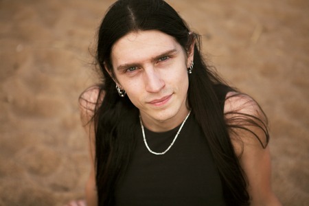 Man standing at beach smilingの写真素材