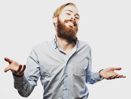 Emotional businessman pulls his hands apart, expressing surprise and disappointment. Business concept.の写真素材