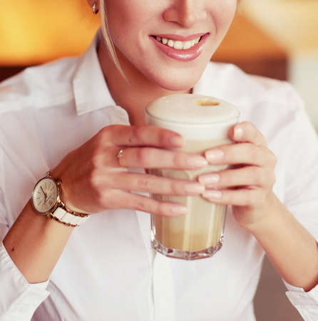 woman drinking coffee in the morning at restaurantの写真素材