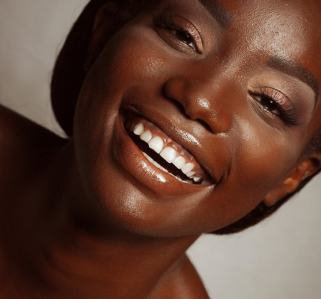 life style and people concept: Close up portrait of confident african american woman laughingの写真素材