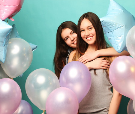 lifestyle and people concept:  two girls friends with colorfoulの写真素材