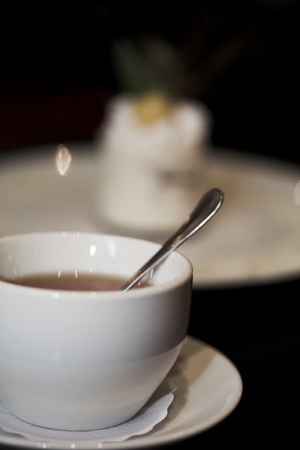 dessert cake and a cup of tea close upの写真素材