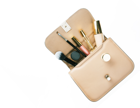 Flat lay of woman handbag accessories and cosmetics on  white background.の写真素材