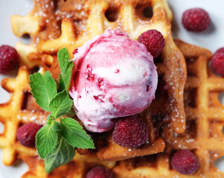 Waffles with raspberry ice cream and fresh raspberries, decorateの写真素材