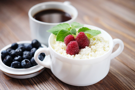 Russian cottage cheese with berry and mint, blueberries and coffの写真素材