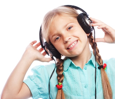 technology, people and music concept - little girl with headphonesの写真素材