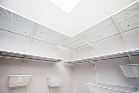 Inside of the empty white walk-in wardrobe close upの写真素材