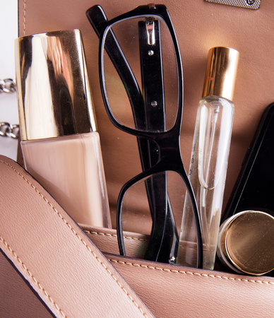 Flat lay of female fashion accessories and pink handbagの写真素材