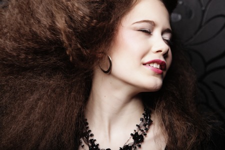 Fashion portrait of young beautiful woman with jewelry and elegant hairstyle.Perfect make-up. Beauty style modelの写真素材