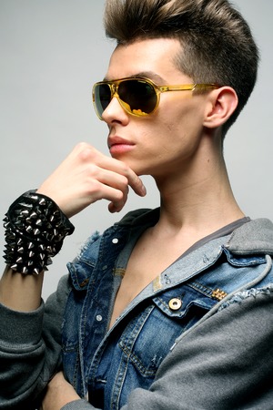 Sexy young man in fashion style wearing sunglasses. Male model.の写真素材