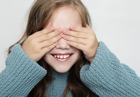 lifestyle, happyness and people concept: little girl with closed eyesの写真素材