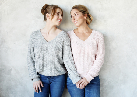 Happy young woman and her mother at home