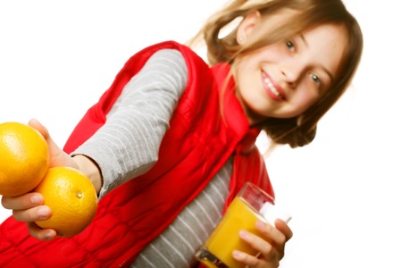 Little girl with oranges and juiceの写真素材