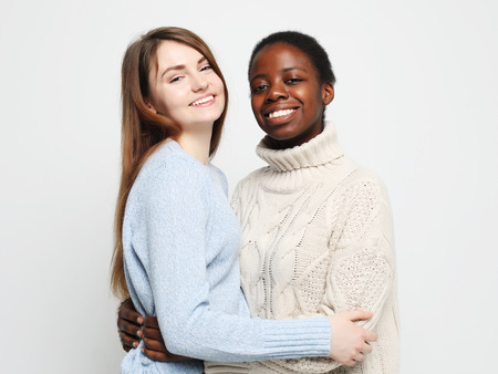 Shot of happy interracial homosexual couple huggingの写真素材