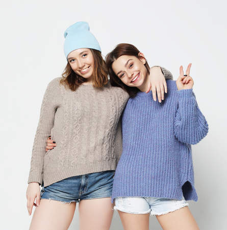two stylish sexy hipster girls best friends.の写真素材