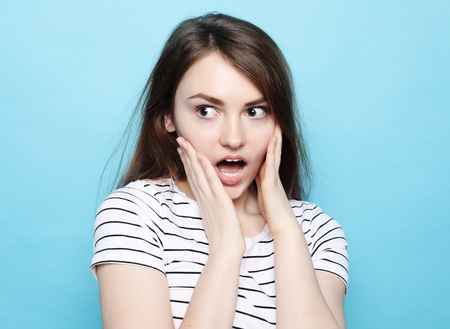 Portrait of young positive female with cheerful expressionの写真素材