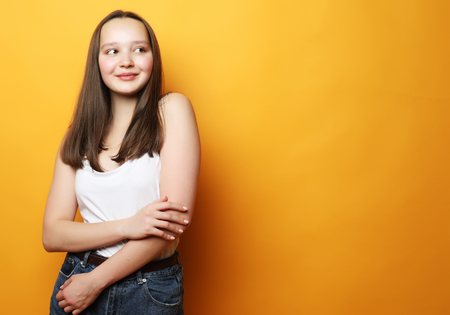 Portrait of young  positive female with cheerful expressionの写真素材