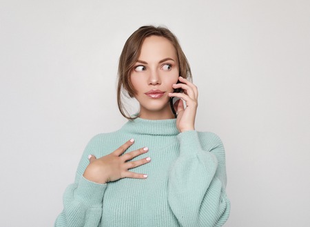 beautiful cheerful woman talking on mobile phoneの写真素材