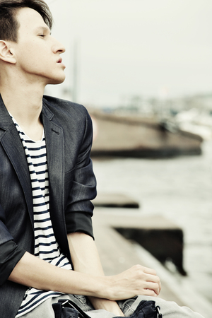 young man wearing casual outdoorsの写真素材