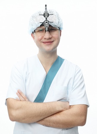 Handsome cheerful young dentistの写真素材