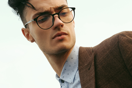 Elegant young handsome man. Outdoors fashion portrait.の写真素材