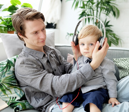 young father holds his little son in his armsの写真素材