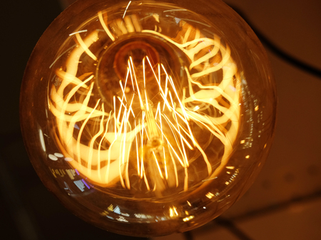 Ceiling lamps on dark background in storeの写真素材