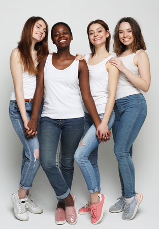 group of four girls friends of different nationalitiesの写真素材