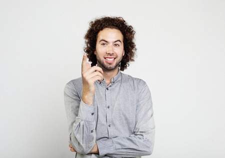 idea, emotion, inspiration and people concept - Excited man pointing a great idea