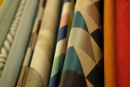 Sale! colorful fabrics in the store, close upの写真素材