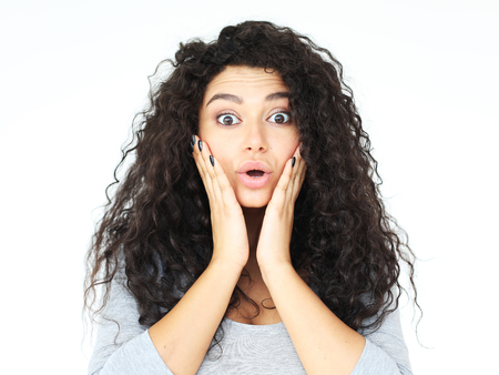 lifestyle,emotion and people concept: surprised young casual girlの写真素材