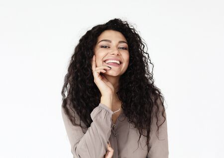 lifestyle, emotion and people concept - young smiling african woman wearing casual over white...