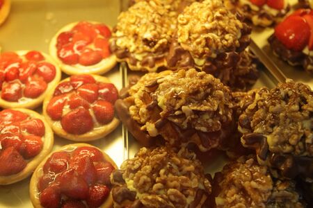 display of delicious looking cakes in a street bar, close upの写真素材