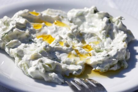 National Greek food - tzatziki served on a white plateの写真素材