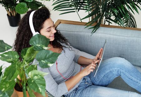 lifestyle, tehnology and people concept - Portrait of an attractive young woman using a digital...