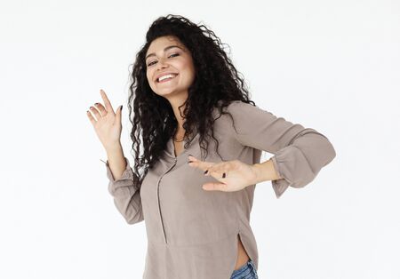 lifestyle, emotion and people concept - Happy young african woman dancing over white background