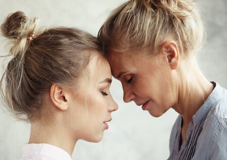 Motherhood maternity femininity concept.Tender gentle adorable sweet mom and beautiful daughter.の写真素材