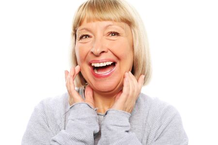 lifestyle, emotion and people concept: old nice beautiful surprised woman. Isolated over white background.の写真素材