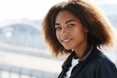 lifestyle, emotion and people concept: Attractive African American womanの写真素材