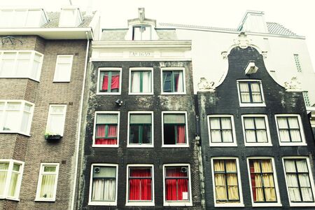 Typical Amsterdam houses summer day, travel concept