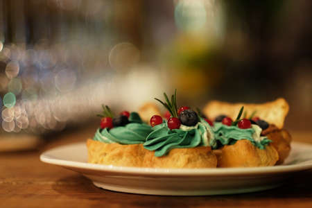 Traditional french eclairs on white plate close upの写真素材